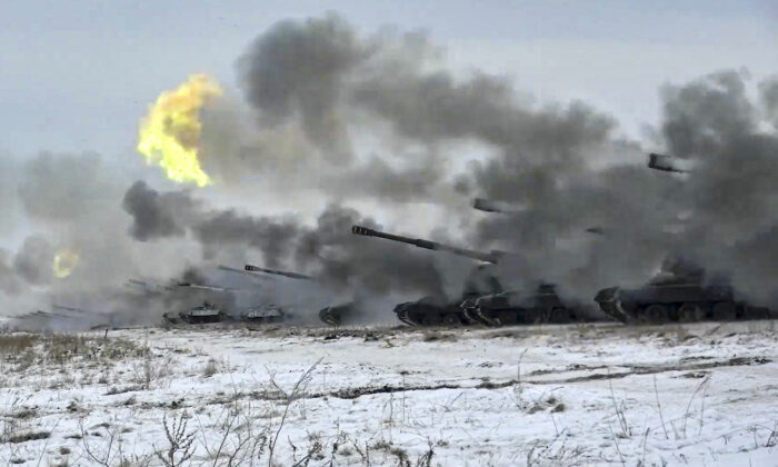 Russian army's self-propelled howitzers fire during military drills near Orenburg in the Urals, Russia, on Dec. 16, 2021. (Russian Defense Ministry Press Service via AP)