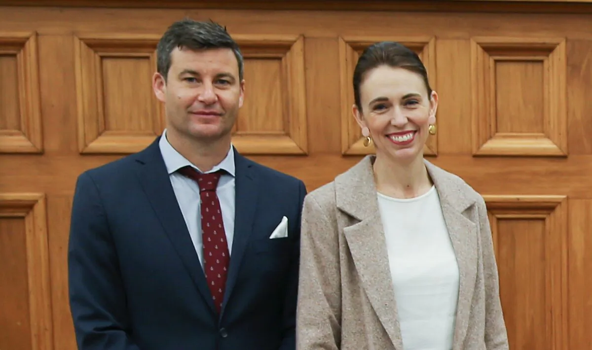 Prime Minister of New Zealand Jacinda Ardern with fiancé Clarke Gayford pose during a swearing-in ceremony at Parliament in Wellington, New Zealand, on Oct. 21, 2021. (Hagen Hopkins/Getty Images)