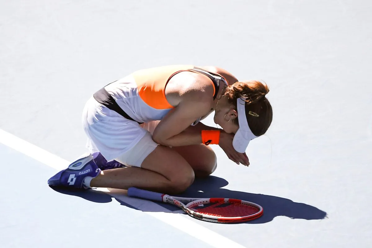 Alize Cornet of France reacts after defeating Simona Halep of Romania in their fourth round match at the Australian Open tennis championships in Melbourne, Australia, on Jan. 24, 2022. (Andy Brownbill/AP Photo)