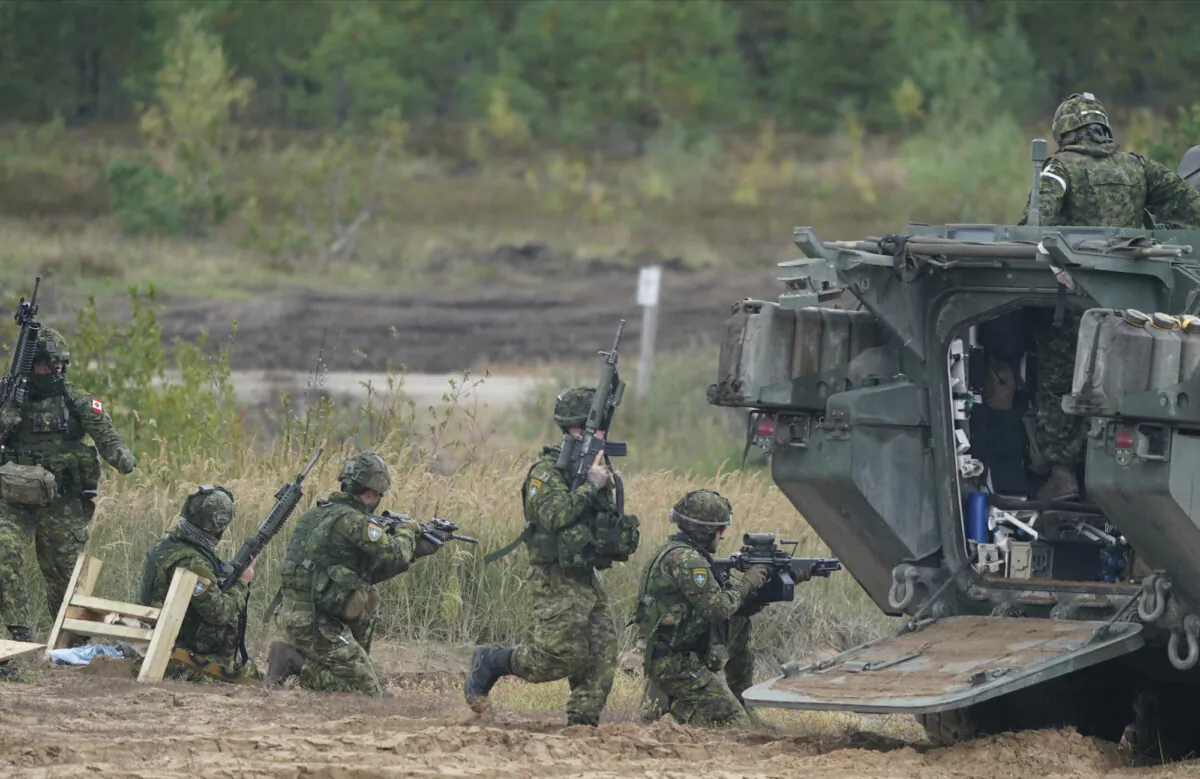 Canadian soldiers attend NATO military exercises at a training ground in Kadaga, Latvia, on Sept. 13, 2021.  (AP Photo/Roman Koksarov, File) 