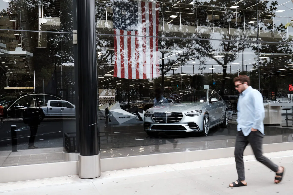 New cars are showcased in the window of a car dealership in New York City, on Oct. 5, 2021. (Spencer Platt/Getty Images)
