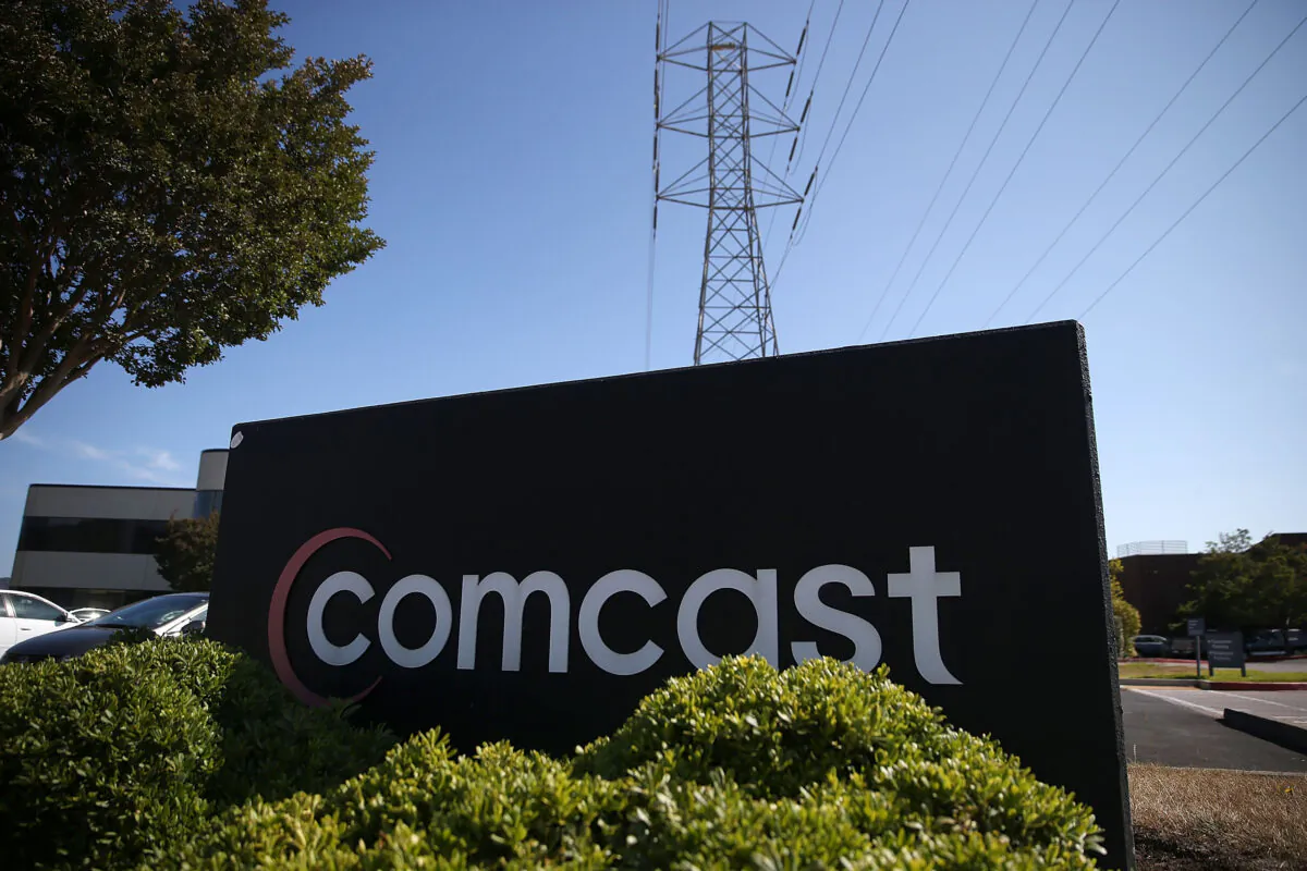 A sign is posted in front of a Comcast service center in San Rafael, Calif., on July 13, 2015. (Justin Sullivan/Getty Images)