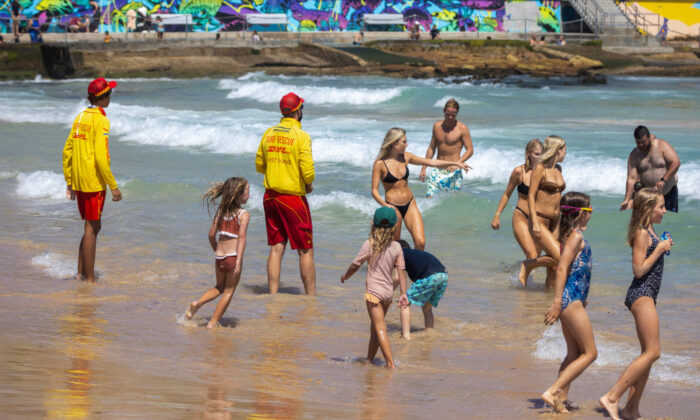 Surf rescue workers instruct swimmers to move away from the northern end of the beach at Bondi Beach in Sydney, Australia on January 16, 2022. (Photo by Jenny Evans/Getty Images)