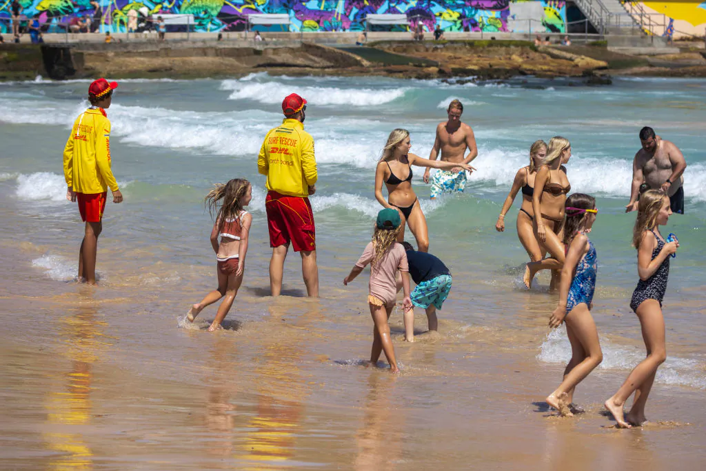 Surf rescue workers instruct swimmers to move away from the northern end of the beach at Bondi Beach in Sydney, Australia on January 16, 2022. (Jenny Evans/Getty Images)