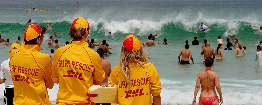 Surf Rescue Lifeguards (L) watch swimmers at Bondi Beach near Sydney on Nov. 22, 2009, as people crowd the beach to beat the heat. (Greg Wood/AFP via Getty Images)