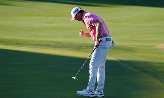 Hudson Swafford pumps his fist after making a putt for par on the 18th hole during the final round of the American Express golf tournament on the Pete Dye Stadium Course at PGA West, Sunday in La Quinta, Calif., on Jan. 23, 2022. (Marcio Jose Sanchez/AP Photo)