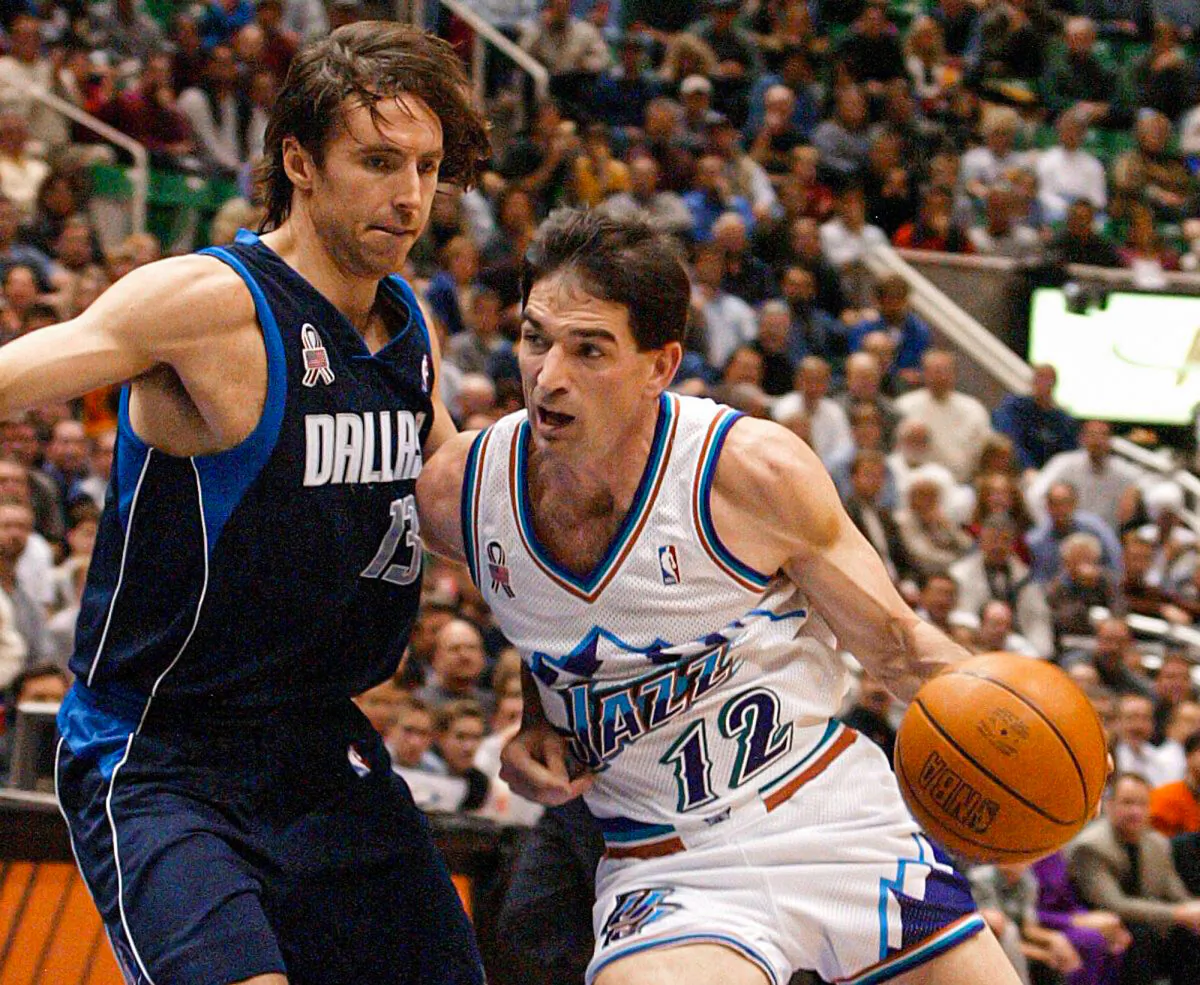 John Stockton (R) of the Utah Jazz drives to the basket past Steve Nash of the Dallas Mavericks during the second quarter in Salt Lake City on Dec. 10, 2001. (George Frey/AFP/Getty Images)