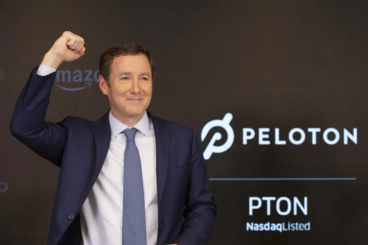 Peloton CEO John Foley celebrates at the Nasdaq MarketSite before the opening bell and his company's IPO, in New York, on Sept. 26, 2019. (Mark Lennihan/AP Photo)
