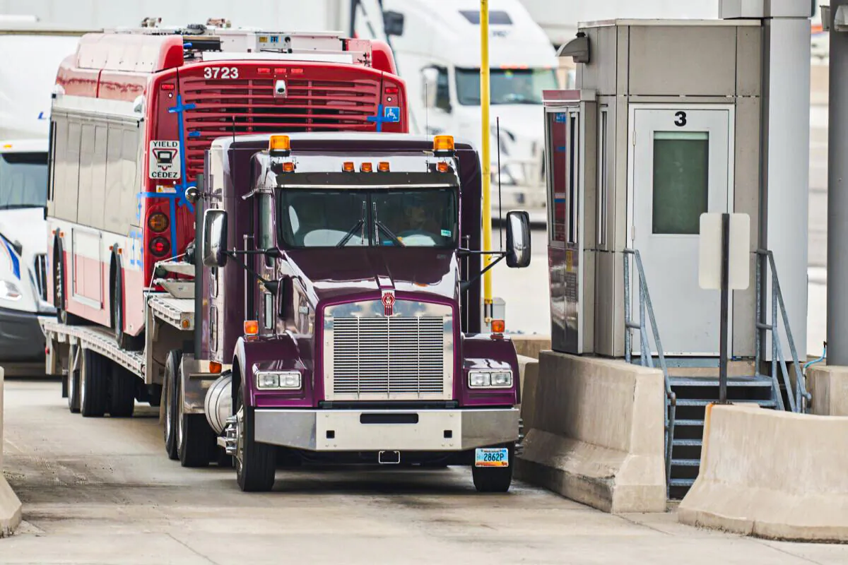 A trucker waits at the Canada Customs booth in Sarnia, Ontario, on March 16, 2020. (Geoff Robins/AFP via Getty Images)