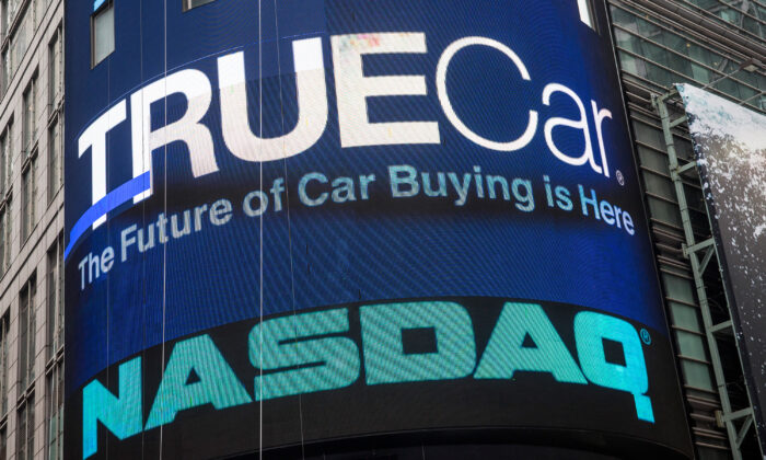 TrueCar's logo is displayed on the Nasdaq billboard in Times Square, New York, on May 16, 2014. (Andrew Burton/Getty Images)