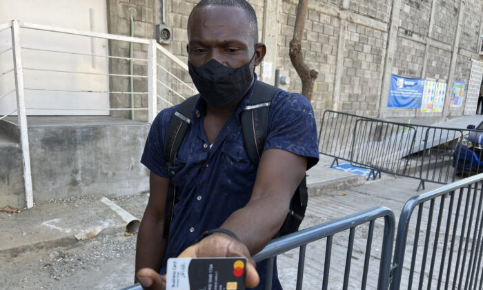 A Haitian immigrant shows his cash card provided by the United Nations. He said his 3,500 peso payment (about $170 US) didn’t deposit this month, in Tapachula, Mexico, on Jan. 14, 2022. (Todd Bensman/Center for Immigration Studies)