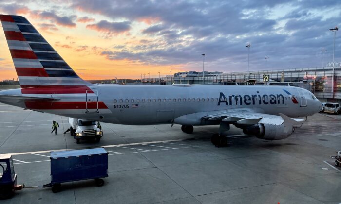 An American Airlines plane is seen at sunrise parked on the tarmac of the Reagan Washington National Airport (DCA) in Arlington, Va., on April 22, 2021. (Daniel Slim/AFP via Getty Images)