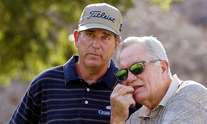Jay Haas (L) talks to 1968 Masters champion Bob Goalby on the fifth hole at Indian Wells Country Club during the third round of the Bob Hope Chrysler Classic golf tournament in Indian Wells, Calif., on Jan. 31, 2003. (Mark J. Terrill/AP Photo)