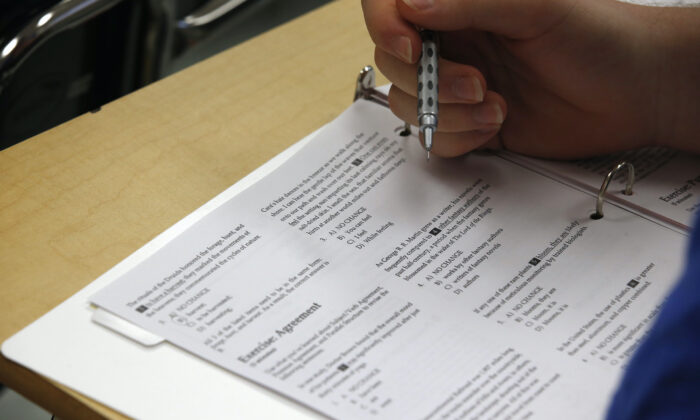 A student looks at questions during a college test preparation class at Holton Arms School in Bethesda, Md.  (Alex Brandon/AP Photo)