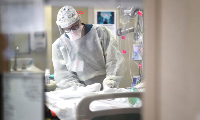 A nurse treats a patient in the intensive care unit at a hospital in Maryland, on May 1, 2020. (Win McNamee/Getty Images)