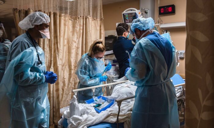 Health care workers tend to a patient at Providence St. Mary Medical Center in Apple Valley, Calif., on Jan. 11, 2021. (Ariana Drehsler/AFP/Getty Images)