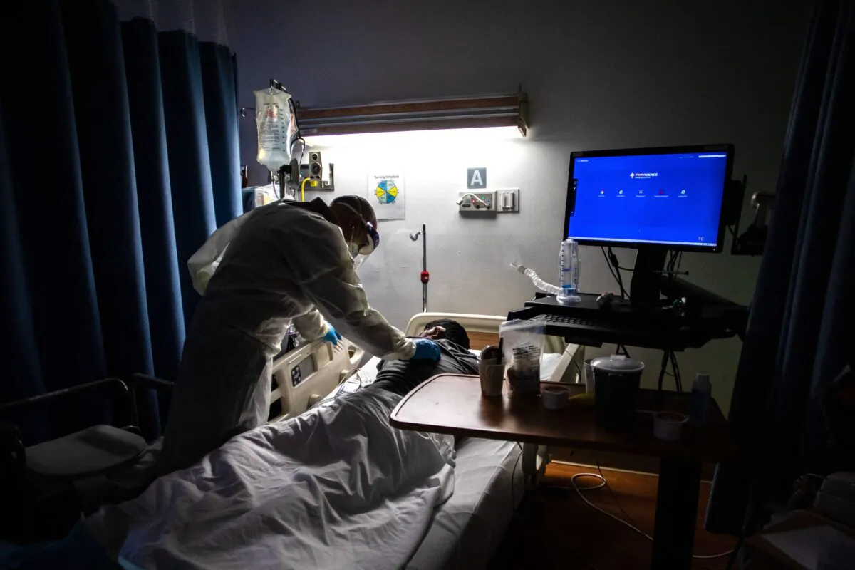 A doctor checks on a 34-year-old COVID-19 patient at a medical center in Tarzana, Calif., on Sept. 2, 2021. (Apu Gomes/AFP via Getty Images)