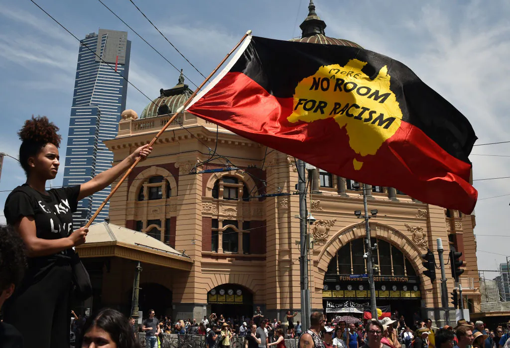 A protester waves a flag during an "Invasion Day" rally on Australia Day in Melbourne, Australia, on Jan. 26, 2018. 
(Peter Parks/AFP via Getty Images)