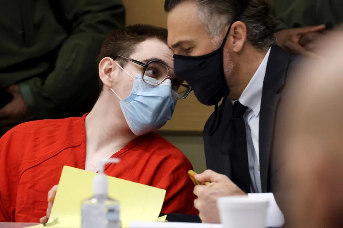 Nikolas Cruz speaks with capital defense attorney Casey Secor during a hearing at the Broward County Courthouse in Fort Lauderdale, Fla., on Jan. 24, 2022. (Amy Beth Bennett/South Florida Sun Sentinel via AP, Pool)