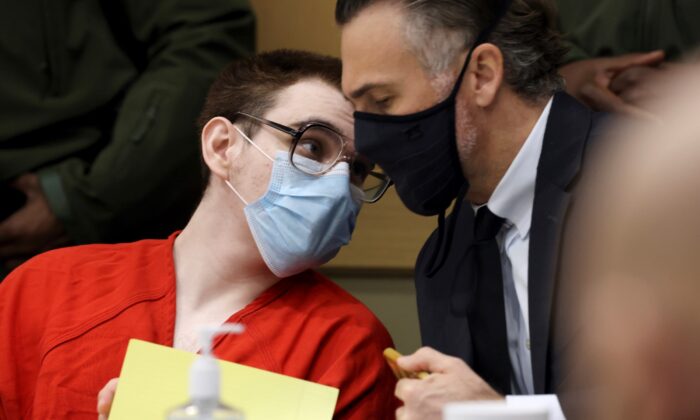Nikolas Cruz speaks with capital defense attorney Casey Secor during a hearing at the Broward County Courthouse in Fort Lauderdale, Fla., on Jan. 24, 2022. (Amy Beth Bennett/South Florida Sun Sentinel via AP, Pool)