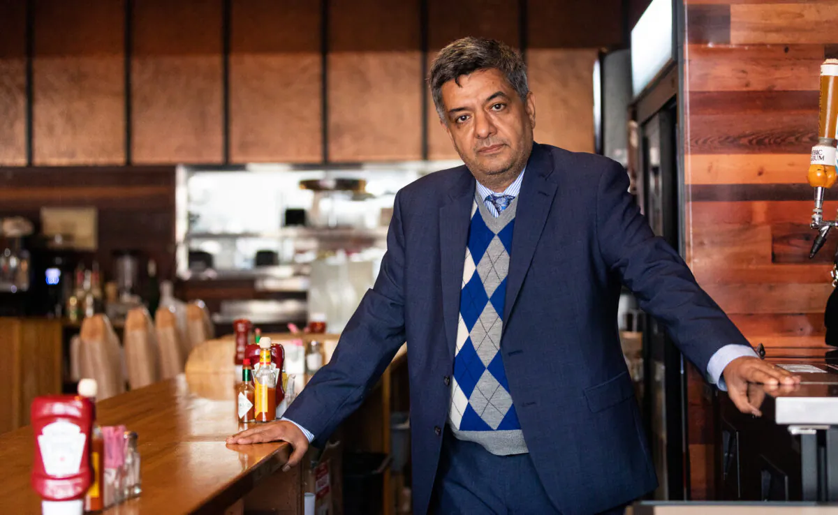 Restaurateur and member of the West Los Angeles Chamber of Commerce Roozbeh Farahanipour at stands in his restaurant in Los Angeles, Calif., on Nov. 18, 2021. (John Fredricks/The Epoch Times)