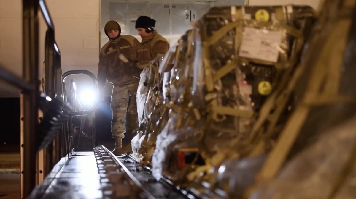 U.S. Air Force personnel preparing supplies inside plane in Dover Air Force Base, Del., on Jan. 24, 2022. (Reuters/Screenshot via The Epoch Times)