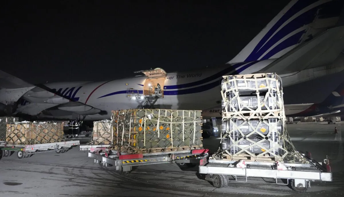 Workers unload a shipment of military aid delivered as part of the United States of America's security assistance to Ukraine, at the Boryspil airport, outside Kyiv, Ukraine, on Jan. 25, 2022. (Efrem Lukatsky/file/AP Photo)
