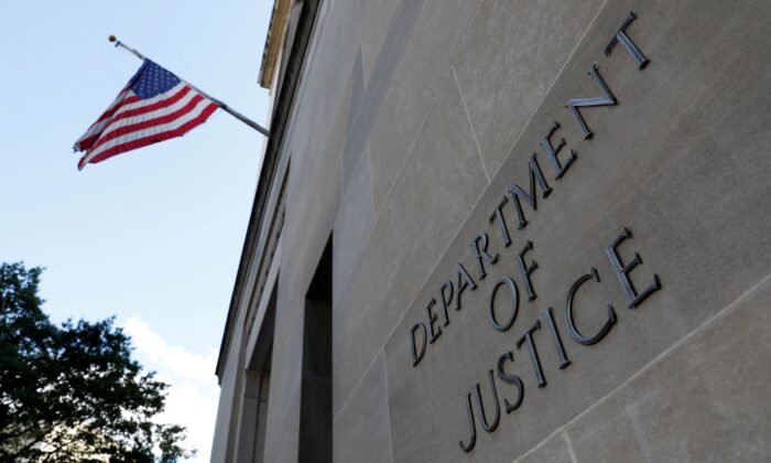 Signage is seen at the United States Department of Justice headquarters in Washington, on Aug. 29, 2020. (Andrew Kelly/Reuters)