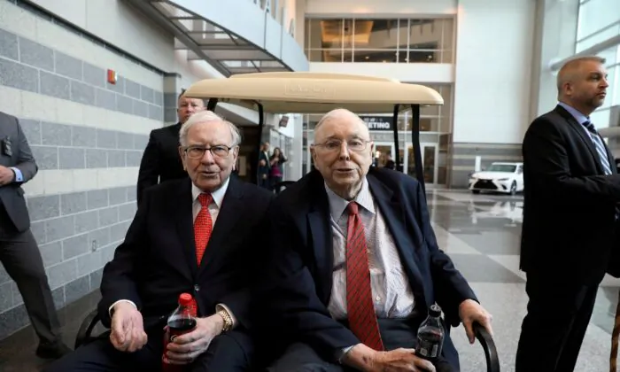 Berkshire Hathaway Chairman Warren Buffett (left) and Vice Chairman Charlie Munger are seen at the annual Berkshire shareholder shopping day in Omaha, Neb., on May 3, 2019. (Scott Morgan/Reuters)
