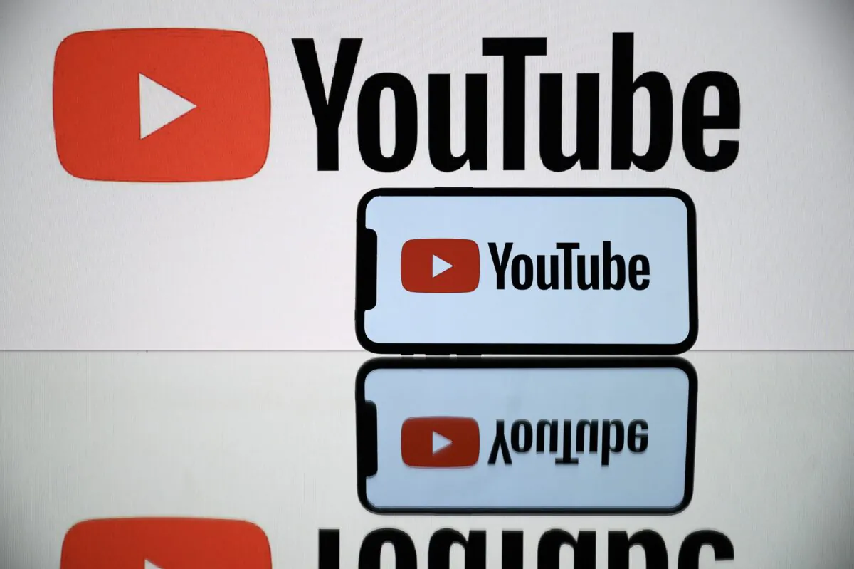 Youtube soial media Logo displayed by a Tablet and a smartphone in Toulouse shows on Oct. 5, 2021. (Lionel onaventure/ AFP via Getty Images)
