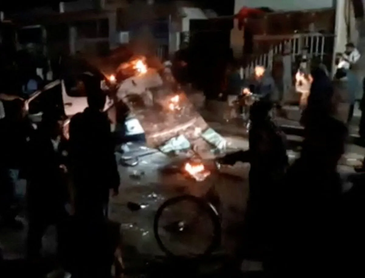 A vehicle burns in the street after a blast ripped through a minivan in the city of Herat, Afghanistan, on Jan. 22, 2022, in this screenshot taken from a video obtained by Reuters. (Reuters)