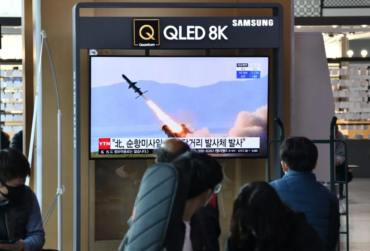 People watch a television news broadcast showing file footage of a North Korean missile test, at a railway station in Seoul on April 14, 2020. (Jung Yeon-je/AFP via Getty Images)