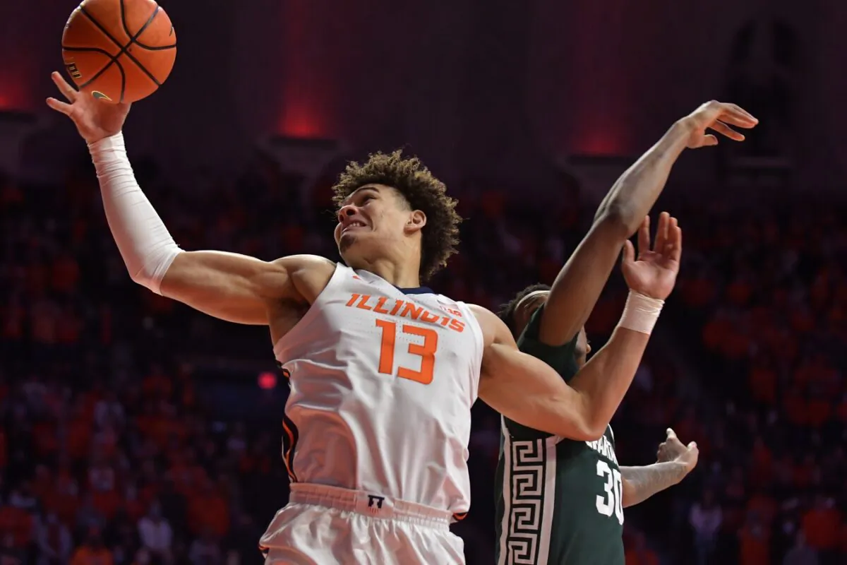 Illinois Fighting Illini forward Benjamin Bosmans-Verdonk (13) drives to the basket as Michigan State Spartans forward Marcus Bingham Jr. (30) defends, during the first half at State Farm Center, in Champaign, Ill., on Jan. 25, 2022. (Ron Johnson/USA TODAY Sports via Field Level Media)