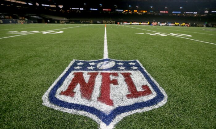 The NFL logo on the field before the game between the New Orleans Saints and the Carolina Panthers at the Caesars Superdome in New Orleans, Louisiana, USA on Jan 2, 2022.  (Chuck Cook-USA TODAY Sports via Reuters)