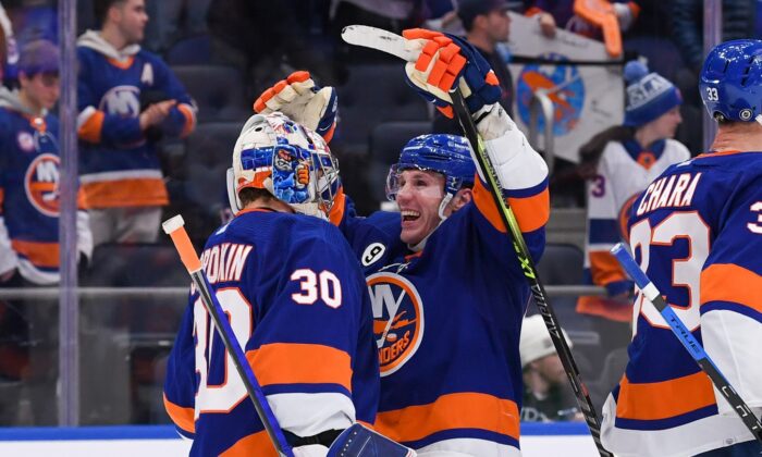 New York Islanders center Casey Cizikas (53) celebrates with goaltender Ilya Sorokin (30) after defeating the Philadelphia Flyers at UBS Arena, in Elmont, New York, on Jan. 25, 2022. (Dennis Schneidler/USA TODAY Sports via Field Level Media)