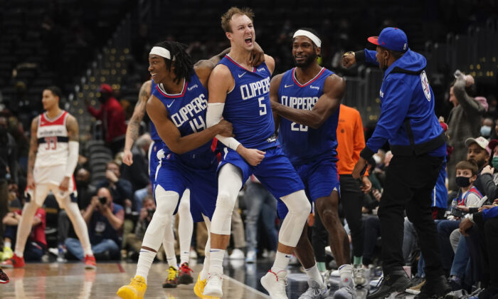 Los Angeles Clippers guard Luke Kennard (5) celebrates after hitting the game tying shot against the Washington Wizards during the second half of an NBA basketball game on Washington on Jan. 25, 2022. The Clippers erased a 35 point deficit to defeat the Wizards 116-115. (Evan Vucci/AP Photo)