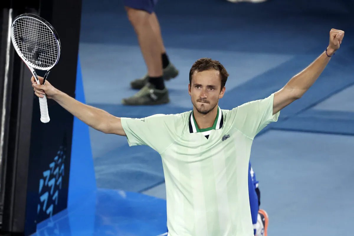 Daniil Medvedev of Russia celebrates after defeating Felix Auger-Aliassime of Canada, in their quarterfinal match at the Australian Open tennis championships in Melbourne, on Jan. 27, 2022. (Hamish Blair/AP Photo)