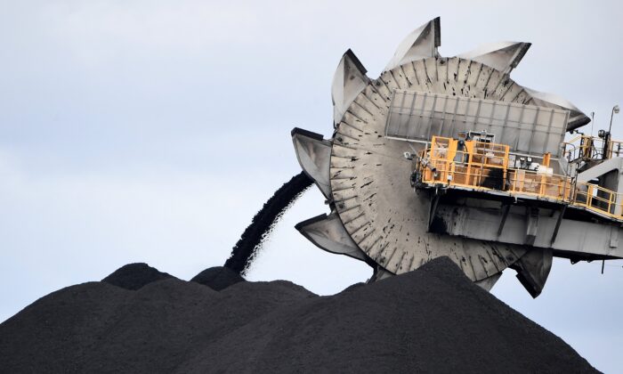 A bucket-wheel excavator dumping soil and sand removed from another area of the mine in Newcastle, Australia, the world's largest coal-exporting port, on Nov. 5, 2021. (Saeed Khan/AFP via Getty Images)