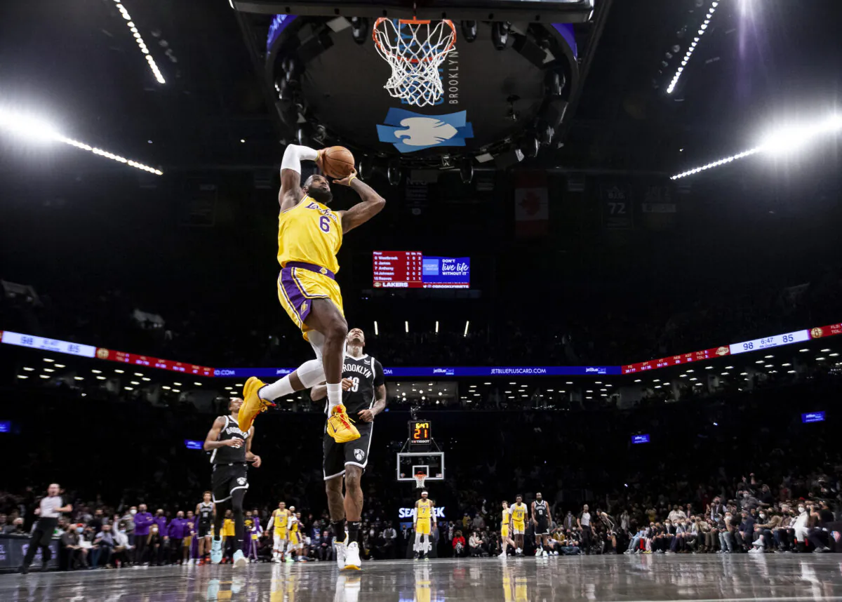 LeBron James #6 of the Los Angeles Lakers dunks against the Brooklyn Nets at Barclays Center, in New York City, on Jan. 25, 2022. (Michelle Farsi/Getty Images)