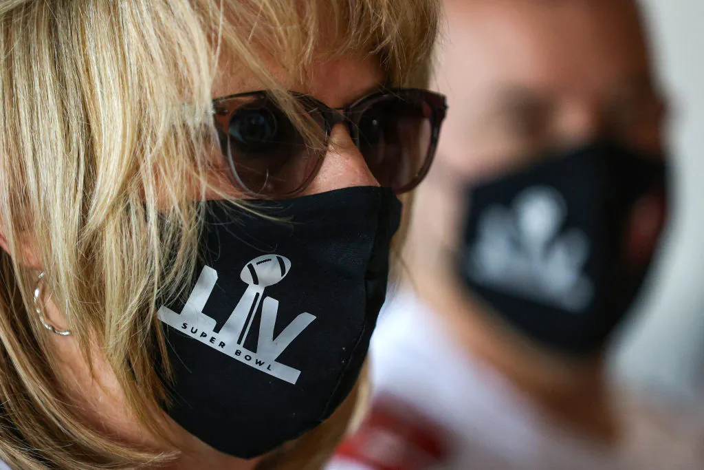 Fans wear protective face masks before Super Bowl LV between the Tampa Bay Buccaneers and the Kansas City Chiefs at Raymond James Stadium in Tampa, Fla., on February 7, 2021. (Patrick Smith/Getty Images)