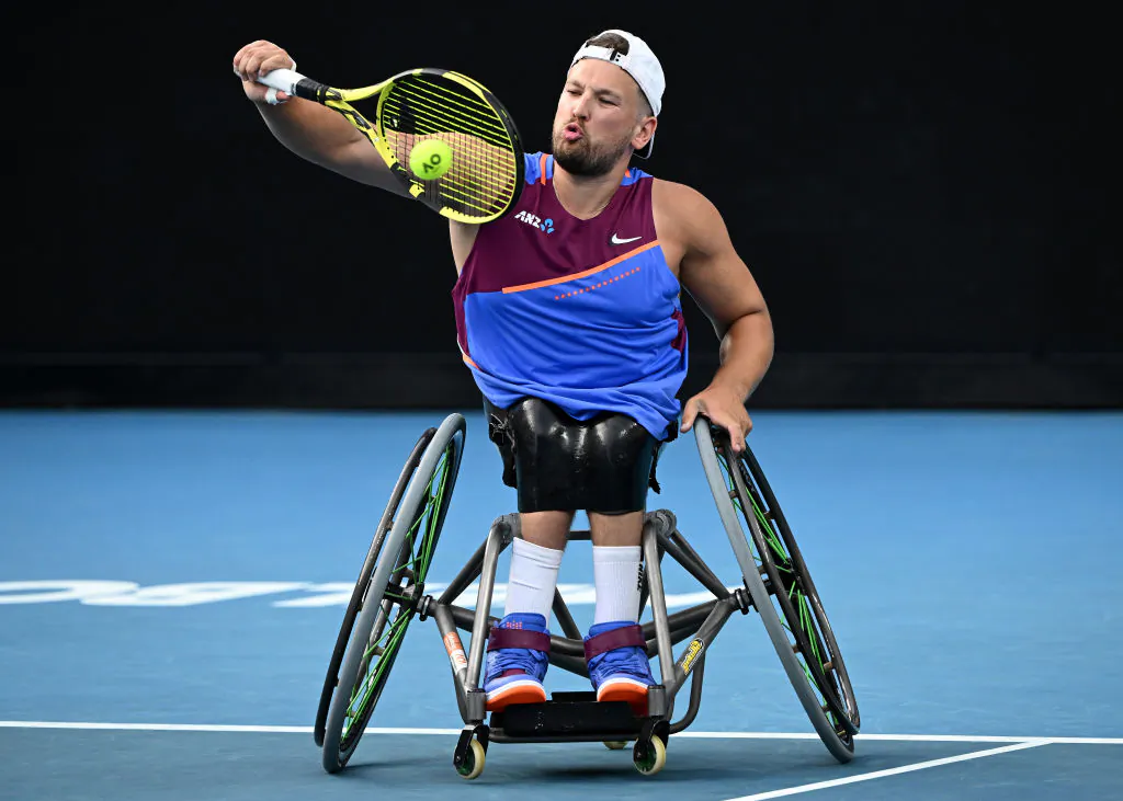 Dylan Alcott of Australia plays a backhand in his Quad Wheelchair singles quarterfinals match against Niels Vink of the Netherlands during day seven of the 2022 Australian Open at Melbourne Park on January 23, 2022 in Melbourne, Australia. (Photo by Quinn Rooney/Getty Images)