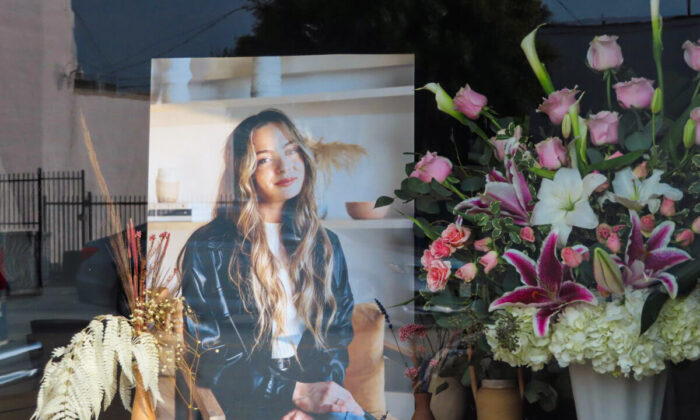 Flowers placed outside Croft House furniture store in memory of graduate student Brianna Kupfer are seen in Los Angeles on Jan. 18, 2022. (Alice Sun/The Epoch Times)