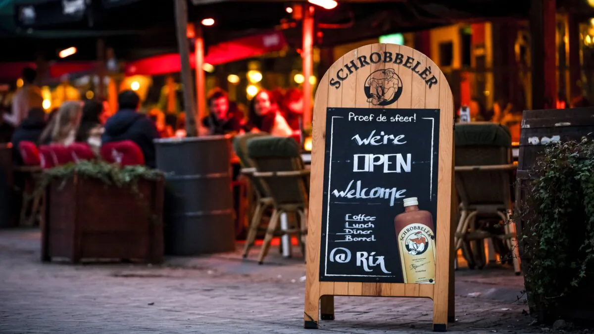 Customers drink and eat at a terrace in Tilburg, the Netherlands, on Jan. 26, 2022. (Rob Engelaar/ANP/AFP via Getty Images)