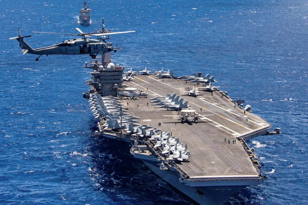 The aircraft carrier USS Carl Vinson participates in a group sail during the Rim of the Pacific exercise off the coast of Hawaii, on July 26, 2018. (Petty Officer 1st Class Arthurgwain L. Marquez/U.S. Navy via AP)