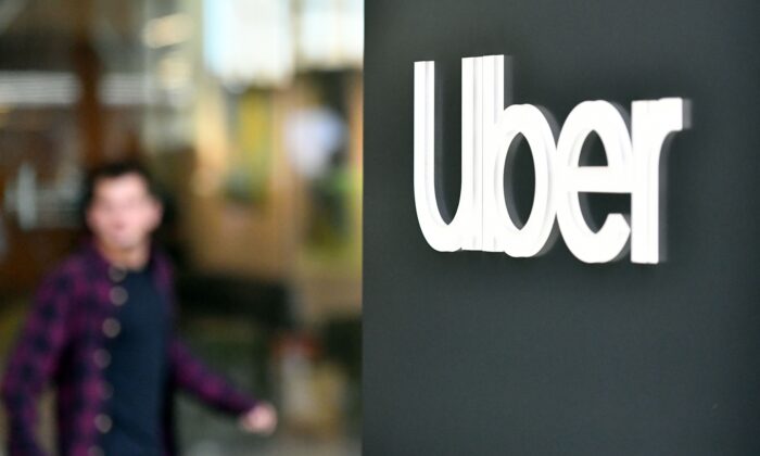 An Uber logo is seen on a sign outside the company's headquarters location in San Francisco, on May 8, 2019.(Josh Edelson/AFP via Getty Images)