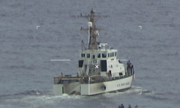 Coast Guard Cutter Ibis' crew searching for people missing from a capsized boat off the coast of Florida, on Jan. 25, 2022. (U.S. Coast Guard via AP)