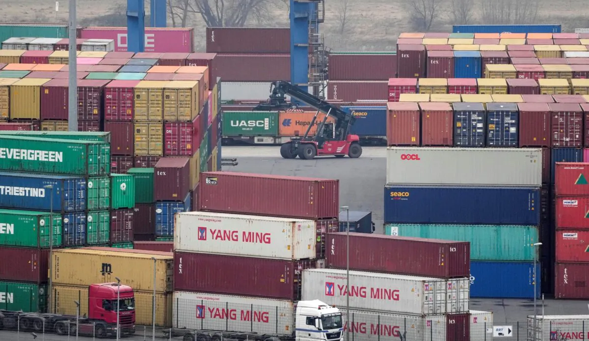 Containers are handled at a logistic port in Duisburg, Germany, on Jan. 25, 2022. (Martin Meissner/AP Photo)