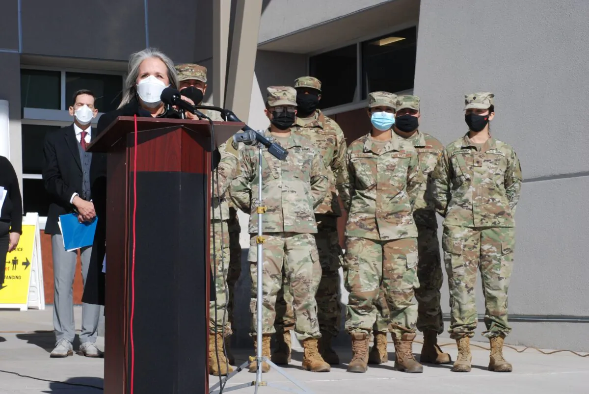 New Mexico Gov. Michelle Lujan Grisham announced efforts to temporarily employ National Guard troops and state bureaucrats as substitute teachers and child care workers during a briefing at Sante Fe High School in Santa Fe, N.M., on Jan. 19, 2022. (Morgan Lee/AP Photo)