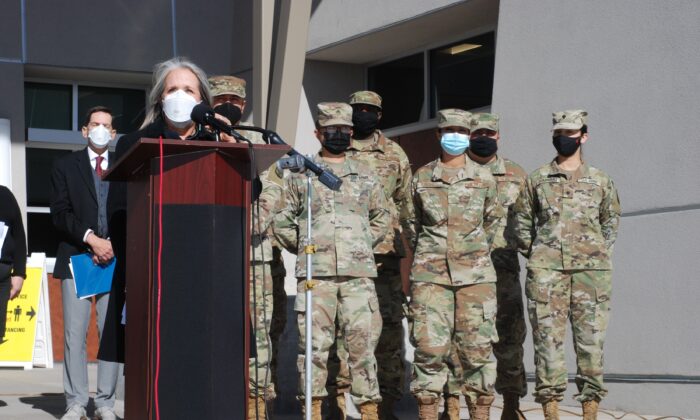 New Mexico Gov. Michelle Lujan Grisham announced efforts to temporarily employ National Guard troops and state bureaucrats as substitute teachers and child care workers during a briefing at Sante Fe High School in Santa Fe, N.M., on Jan. 19, 2022. (Morgan Lee/AP Photo)