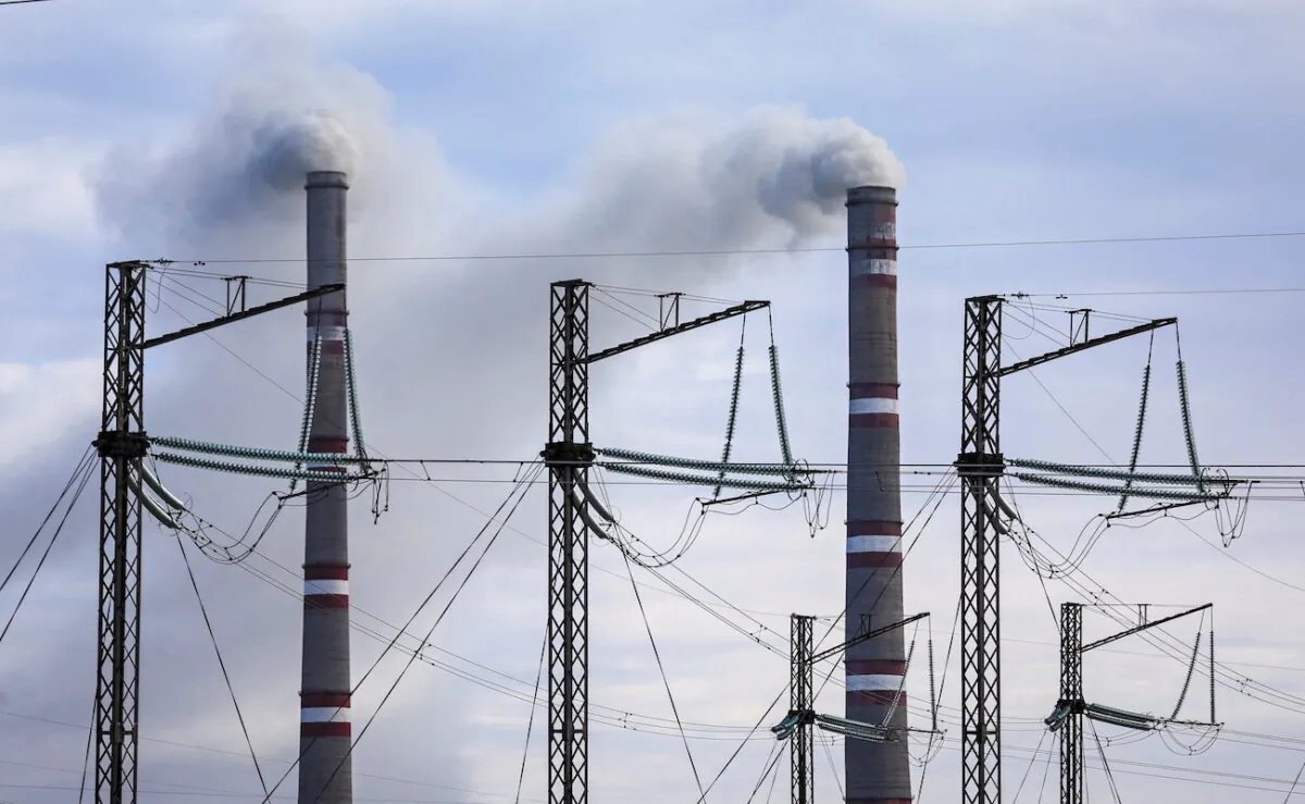 Pylons of high-tension electricity power lines are seen next to the GRES-1 coal-fired thermal power plant outside the town of Ekibastuz, Kazakhstan, on Nov. 7, 2021. (Pavel Mikheyev/Reuters)